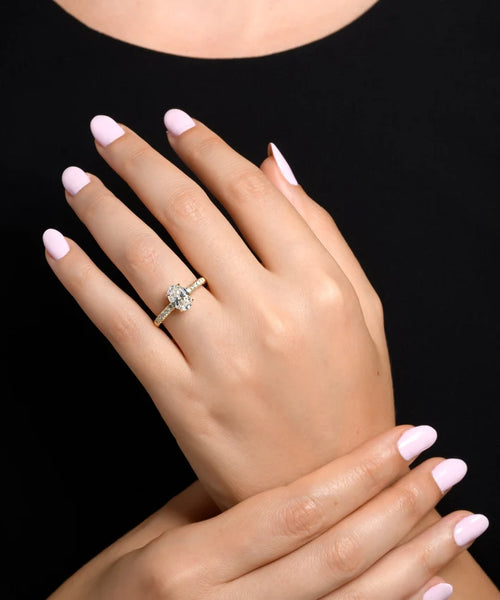 The Pinnacle of Elegance: 1.81 CT Oval Diamond with Side Stones in Yellow Gold