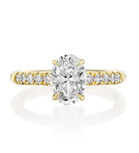 The Pinnacle of Elegance: 1.81 CT Oval Diamond with Side Stones in Yellow Gold